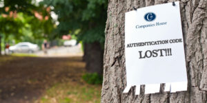 Image with notice nailed to a tree with the headline 'AUTHENTICATION CODE LOST!!!'