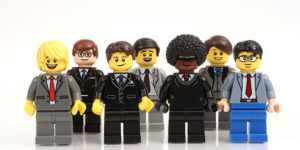 A group of Lego Men in business suits, symbolising members of a Limited Liability Partnerships.