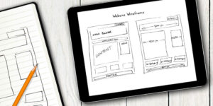 Image on an iPad displaying a hand-drawn sketch of a web page layout.