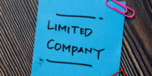 Blue 'post-it' note with the words LIMITED COMPANY in black marker pen.