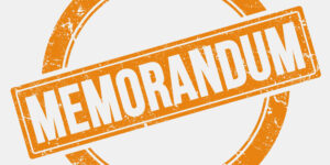 Illustration displaying the word MEMORANDUM created by a stamp in orange ink with white background.