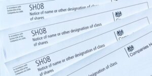 Image of several Companies House 'SHO8 forms - Notice of name or other designation of class of shares' which is used to redesignate shares.