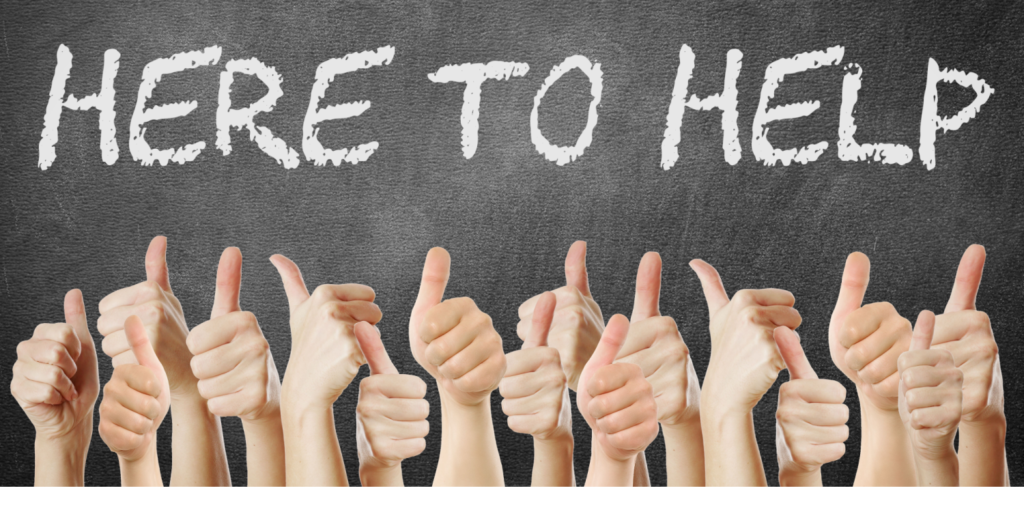 HERE TO HELP is written in white chalk on a blackboard with hands below displaying the thumbs-up sign.