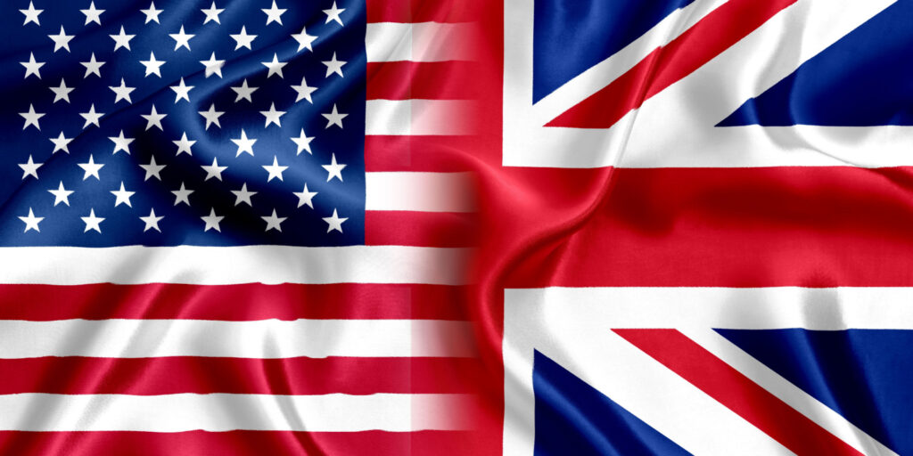 Concept image displaying silk versions of the United Kingdom and US flags merging together.