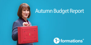 Rachel Reeves holds a red briefcase against a blue background, symbolizing the Autumn Budget Report and its significant impact on businesses.