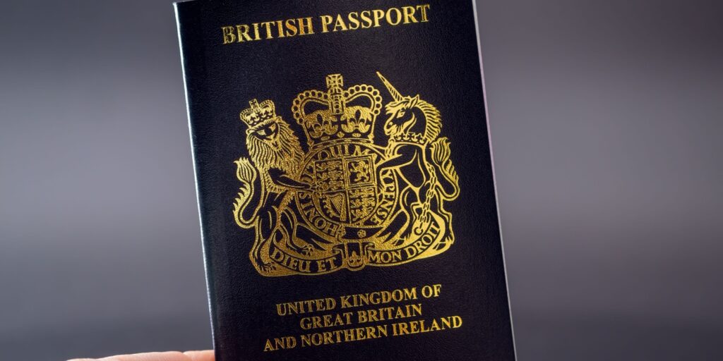 Image of a hand holding a British passport